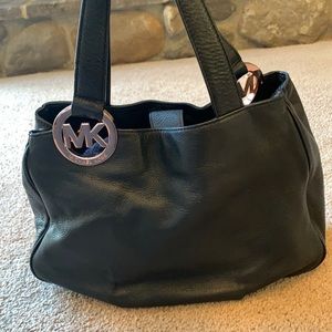 Black pebble leather Micheal Kors purse with rose gold.